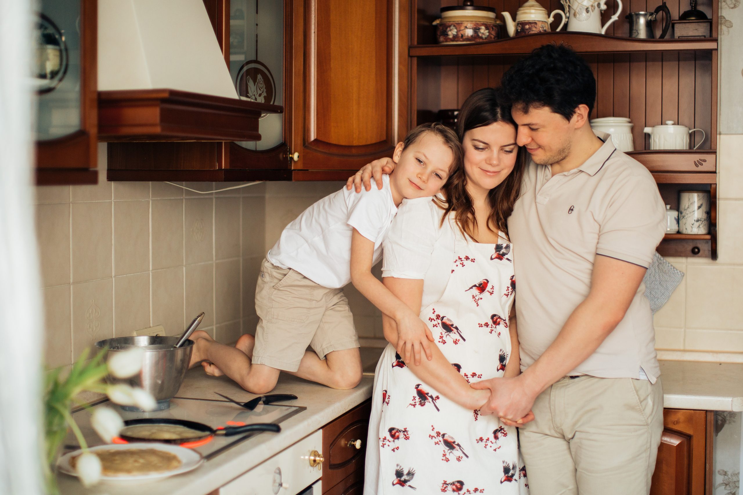Canva – Photo of Family Standing Near Kitchen Counter While Smiling